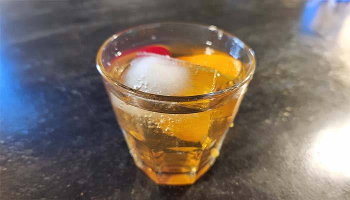 Whiskey or brandy old fashioned cocktail served at The Hideout restaurant and bar in Stacy, MN Whiskey or brandy old fashioned cocktail served at The Hideout restaurant and bar in Stacy, MN