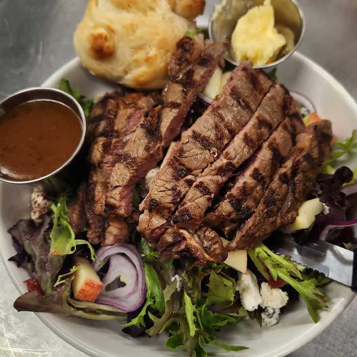 Cranberry harvest steak salad served at The Hideout restaurant and bar in Stacy, MN