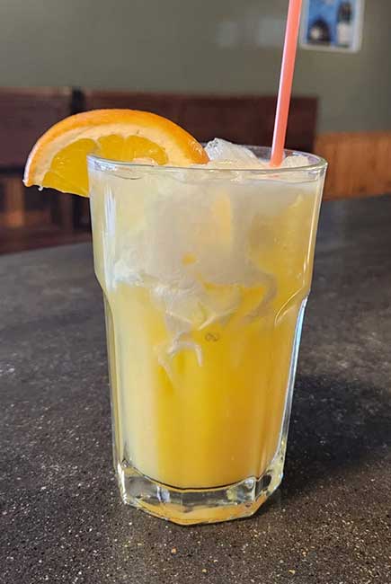 Dreamsicle orange cream cocktail served at The Hideout restaurant and bar in Stacy, MN