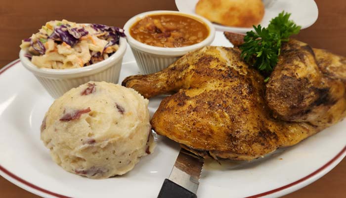 Baked half chicken with side of mashed potatoes served at The Hideout restaurant and bar in Stacy, MN