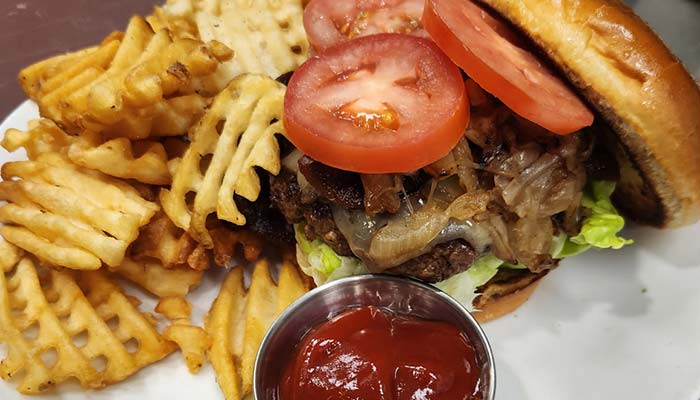 Build your own burger served at The Hideout restaurant and bar in Stacy, MN Build your own burger served at The Hideout restaurant and bar in Stacy, MN